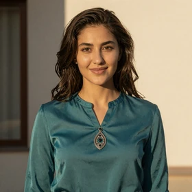 Nuriza, a 26-year-old Kyrgyz woman from Osh with confident smile seeking meaningful relationship