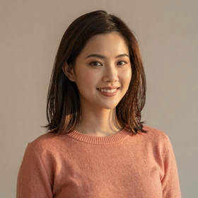 Grace Lim, a 27-year-old Singaporean woman with medium-length brown hair and genuine smile looking for Western partner